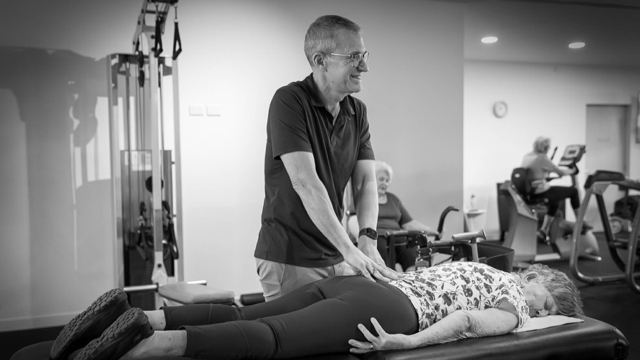 Miles Browning assessing movement in a clinical gym